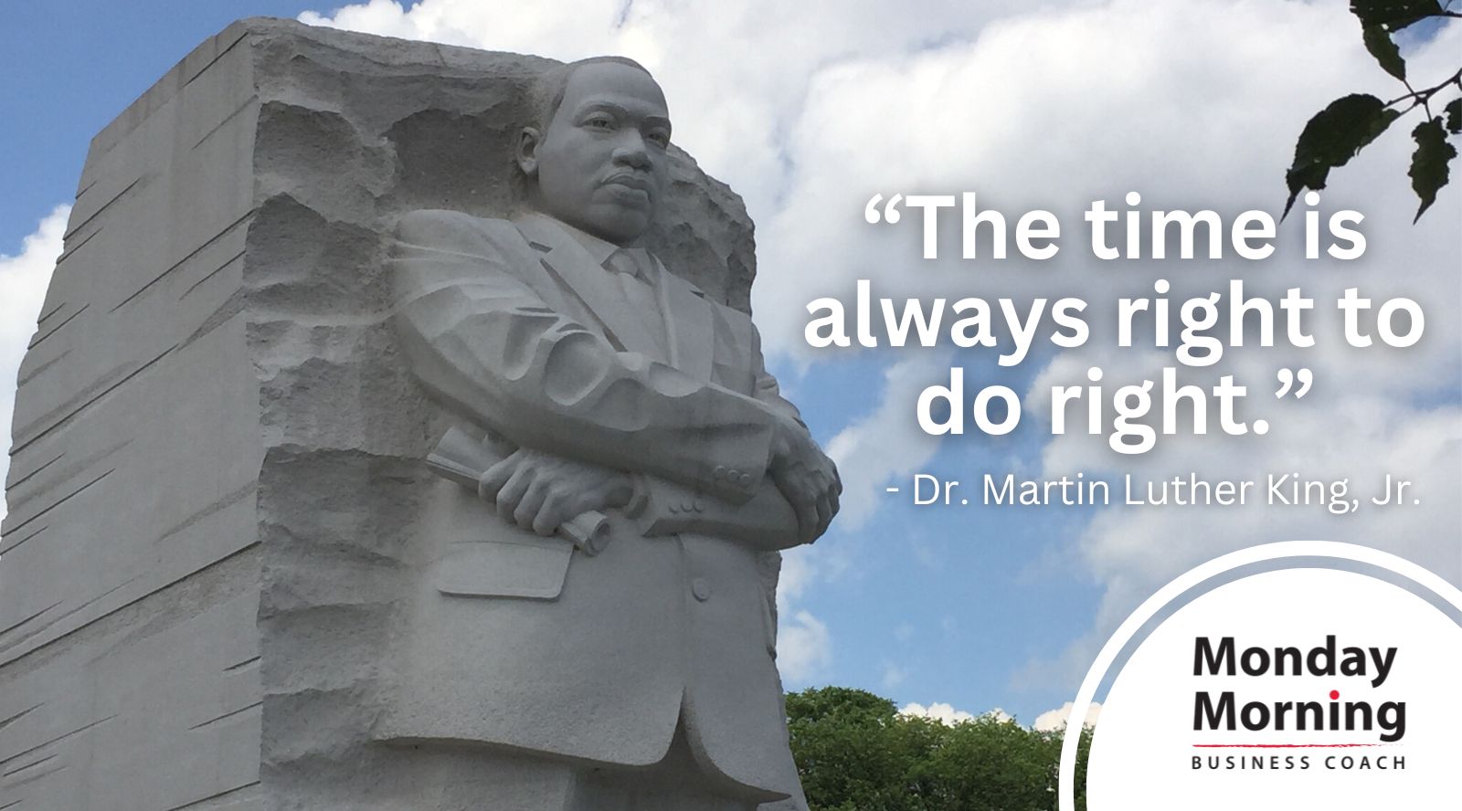 Image of Dr. Martin Luther King Jr. statue with a quote of his.